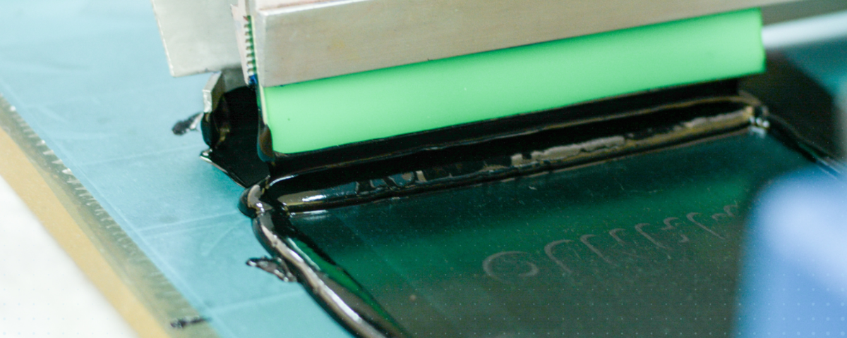 Conductive ink being screen printed with green squeegee